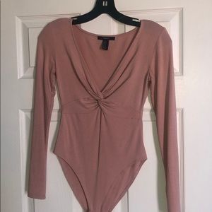 pink bodysuit with a knot in the middle